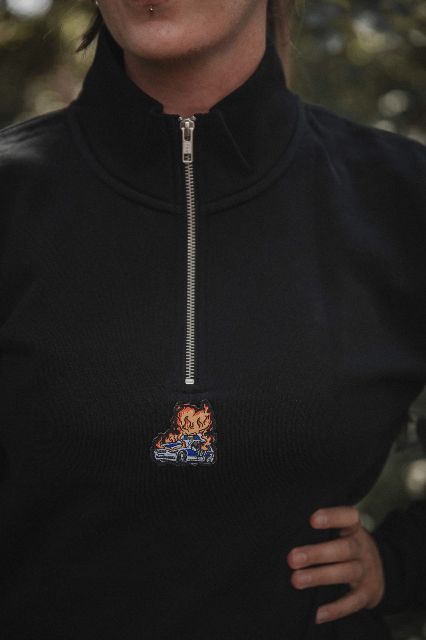 unisex 1/4 zipper "burning cop car"